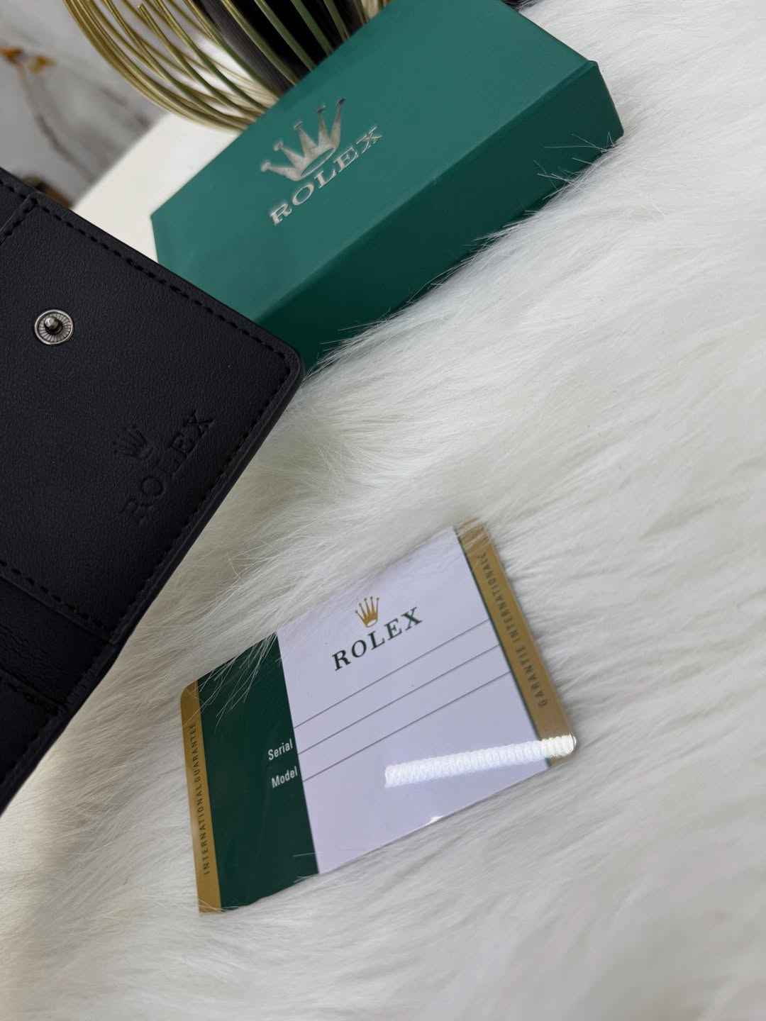Rolex sleek bi-fold wallet