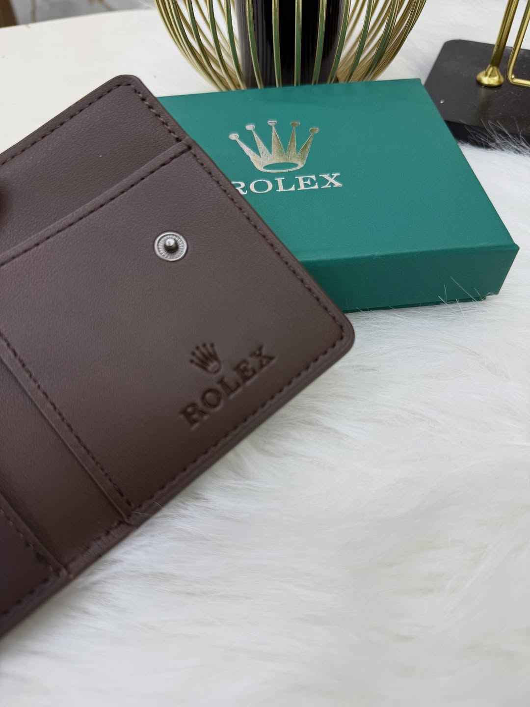 Rolex sleek bi-fold wallet