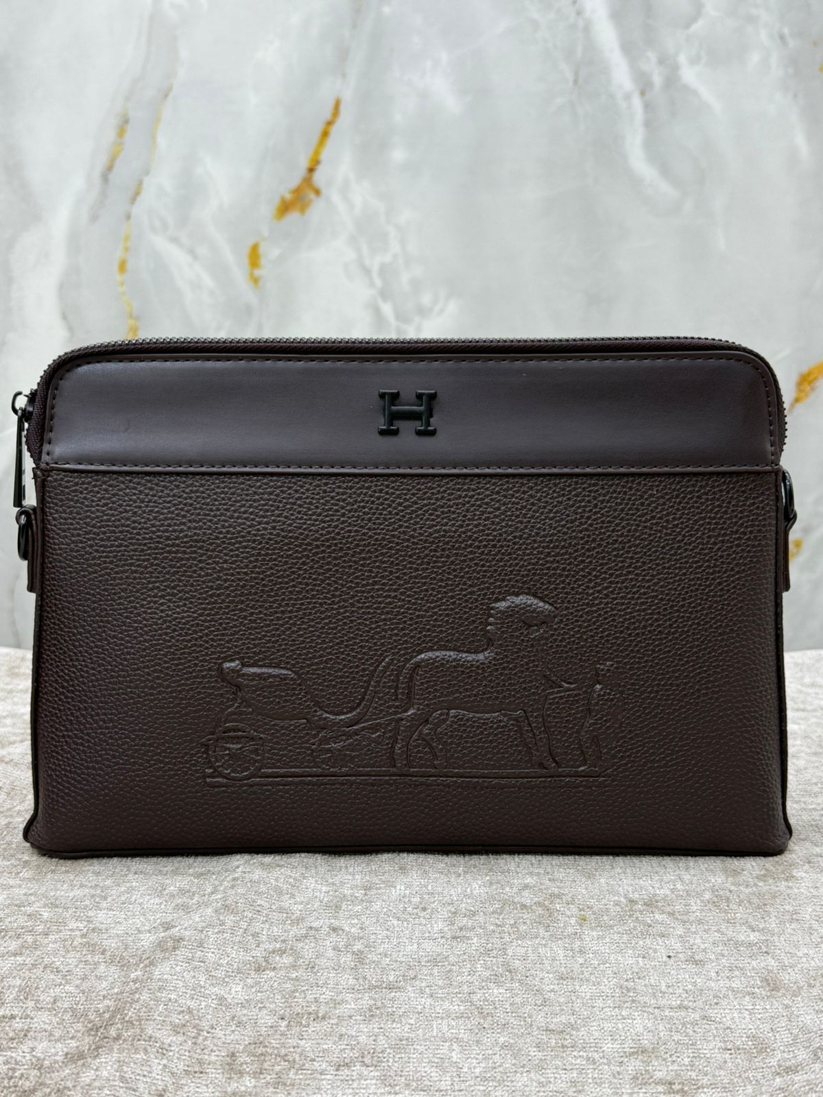 Hermès Leather Clutch Bag with Embossed Horse Carriage Logo